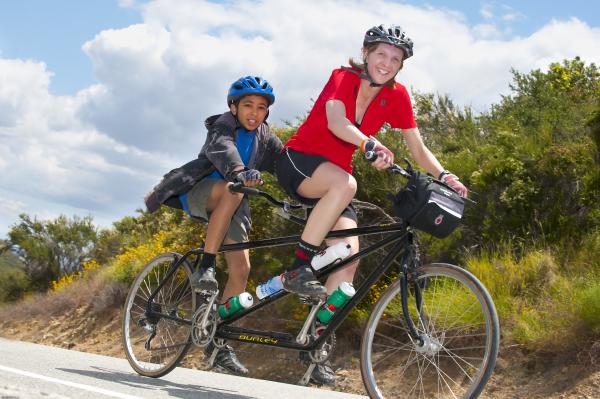 Christine piloting a tandem with 12 year old boy as stoker